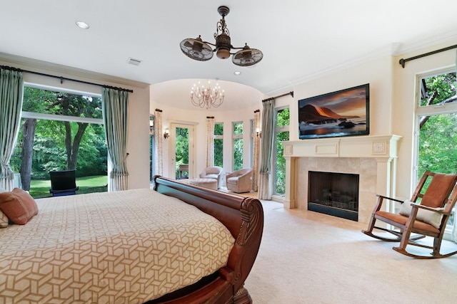 2306 Autumn Run Ct, Cedar Hill, TX 75104 - carpeted bedroom featuring a chandelier, access to outside, multiple windows, a fireplace, and crown molding