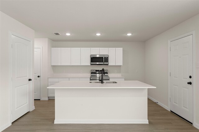 122 Doma Ave, Greenville, TX 75402 - bathroom with double vanity, wood finished floors, and an enclosed shower