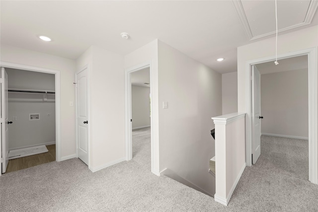 122 Doma Ave, Greenville, TX 75402 - hallway featuring attic access, carpet, an upstairs landing, and recessed lighting