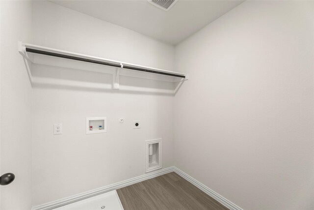 122 Doma Ave, Greenville, TX 75402 - ensuite bathroom with vanity, a shower stall, and wood finished floors