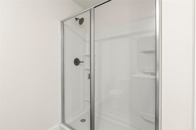 122 Doma Ave, Greenville, TX 75402 - bathroom featuring a stall shower