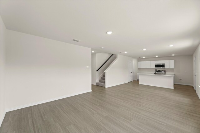 122 Doma Ave, Greenville, TX 75402 - dining space with wood finished floors and recessed lighting