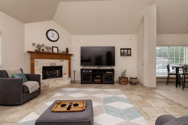 3404 Brookshire Run, Corinth, TX 76210 - living area featuring vaulted ceiling, a stone fireplace, and baseboards