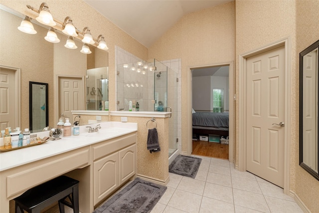 3404 Brookshire Run, Corinth, TX 76210 - bathroom with vaulted ceiling, tile patterned flooring, a shower stall, vanity, and ensuite bathroom
