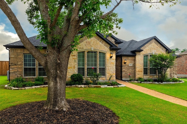3404 Brookshire Run, Corinth, TX 76210 - french provincial home with stone siding, a front lawn, and roof with shingles