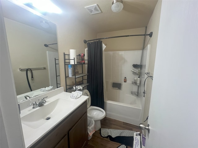 306 Valley Lake Ct, Springtown, TX 76082 - bathroom with wood finished floors, shower / bath combo, vanity, and toilet