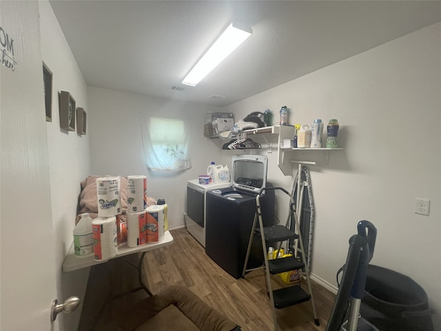 306 Valley Lake Ct, Springtown, TX 76082 - laundry area with washer and dryer, wood finished floors, and baseboards