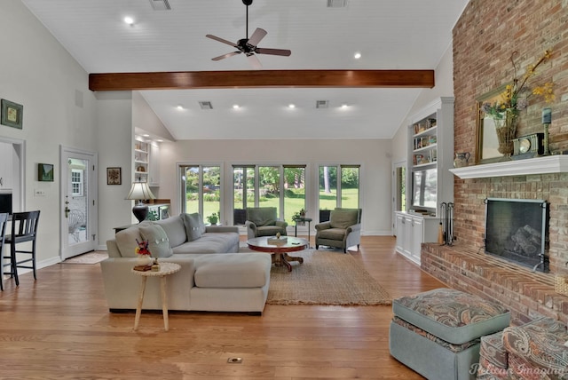 6706 Querbes Dr, Shreveport, LA 71106 - living area featuring light wood finished floors, baseboards, a ceiling fan, and a fireplace