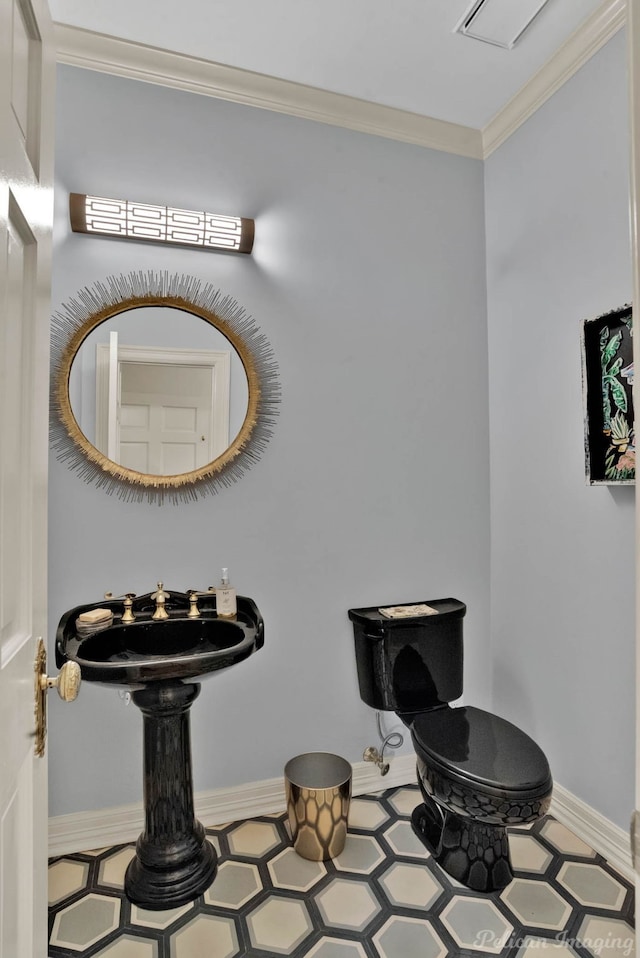 6706 Querbes Dr, Shreveport, LA 71106 - half bath with crown molding, toilet, baseboards, and tile patterned floors