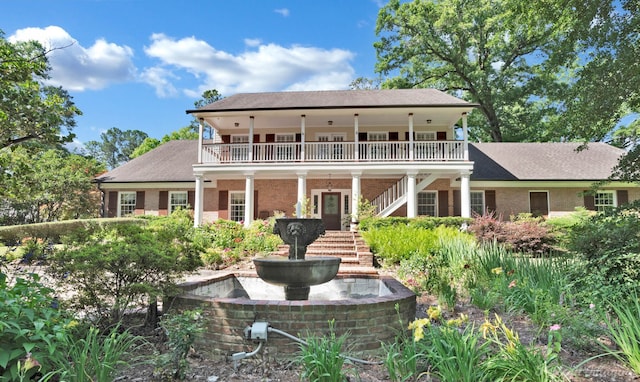 6706 Querbes Dr, Shreveport, LA 71106 - rear view of property featuring stairway, a porch, and a shingled roof