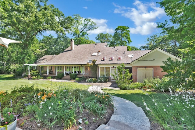 6706 Querbes Dr, Shreveport, LA 71106 - view of front of home featuring a front yard, a chimney, brick siding, and a shingled roof