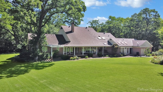6706 Querbes Dr, Shreveport, LA 71106 - rear view of property featuring a yard, covered porch, and a chimney