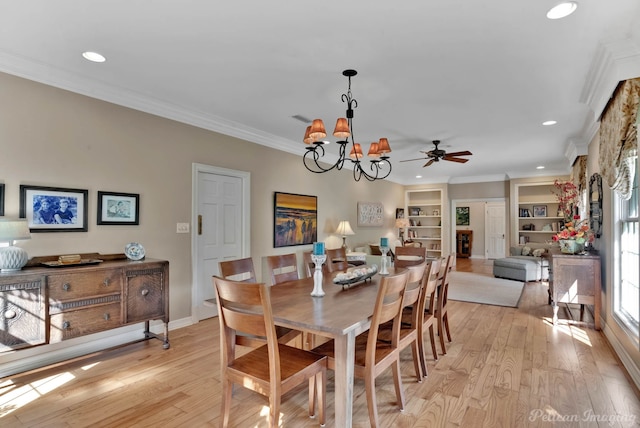 6706 Querbes Dr, Shreveport, LA 71106 - dining space featuring crown molding, light wood-type flooring, a chandelier, recessed lighting, and built in features