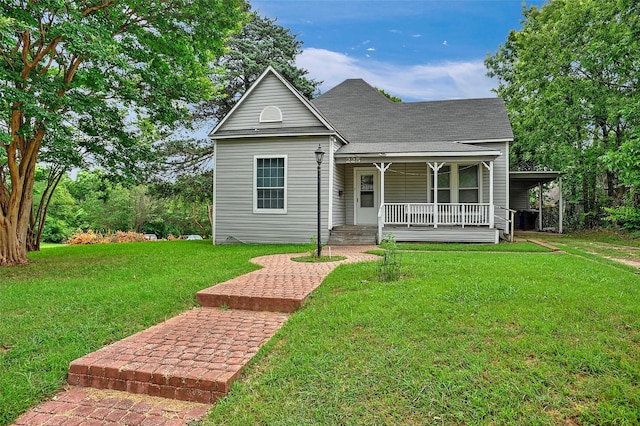 225 N Binkley St, Sherman, TX 75092 - view of front facade featuring covered porch, a front lawn, and a shingled roof