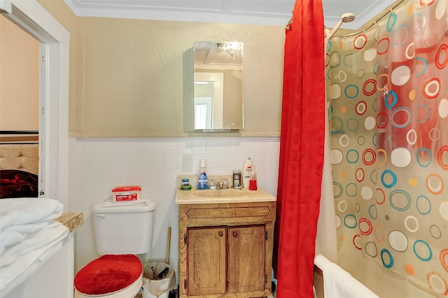225 N Binkley St, Sherman, TX 75092 - bathroom with shower / bathtub combination with curtain, toilet, tile walls, vanity, and wainscoting
