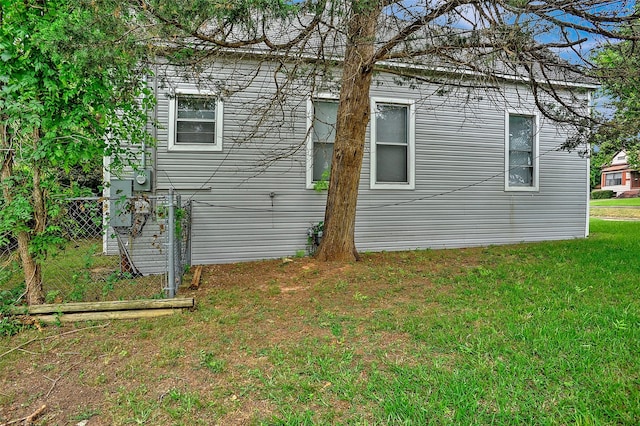 225 N Binkley St, Sherman, TX 75092 - view of side of home with a lawn