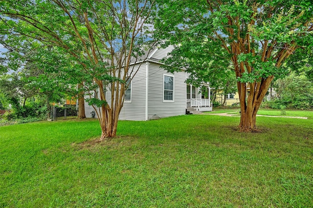 225 N Binkley St, Sherman, TX 75092 - view of home's exterior with a yard