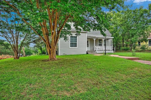 225 N Binkley St, Sherman, TX 75092 - view of front of home featuring a porch and a front yard