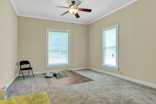 225 N Binkley St, Sherman, TX 75092 - spare room with carpet, plenty of natural light, a ceiling fan, crown molding, and baseboards