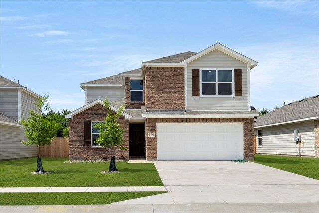 120 Doma Ave, Greenville, TX 75402 - view of front of home with brick siding, driveway, a garage, and a front lawn