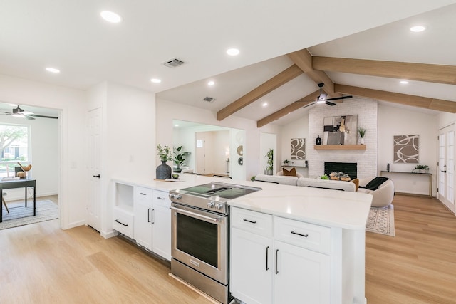 2505 Kelsey Dr, Plano, TX 75075 - kitchen with a ceiling fan, stainless steel range with electric cooktop, light wood-style flooring, a peninsula, and recessed lighting