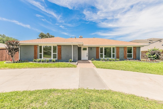 2505 Kelsey Dr, Plano, TX 75075 - ranch-style home featuring brick siding and a front yard