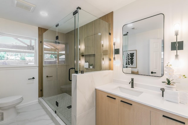 2505 Kelsey Dr, Plano, TX 75075 - bathroom featuring toilet, vanity, a stall shower, and marble finish flooring