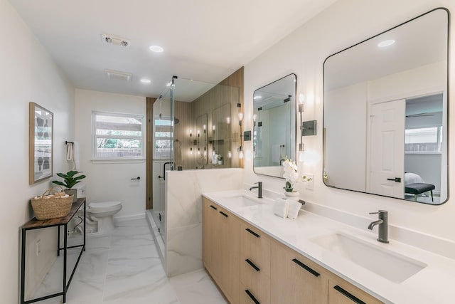 2505 Kelsey Dr, Plano, TX 75075 - ensuite bathroom with double vanity, a stall shower, toilet, marble finish flooring, and recessed lighting