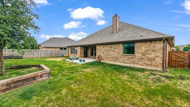 110 Emilie Ct, Weatherford, TX 76087 - back of property featuring a patio, a chimney, brick siding, and a shingled roof