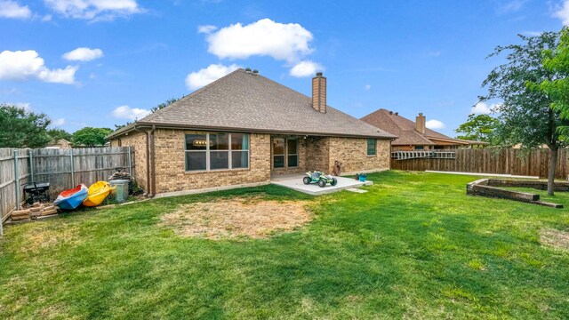 110 Emilie Ct, Weatherford, TX 76087 - rear view of property featuring brick siding, a patio area, a chimney, and a shingled roof
