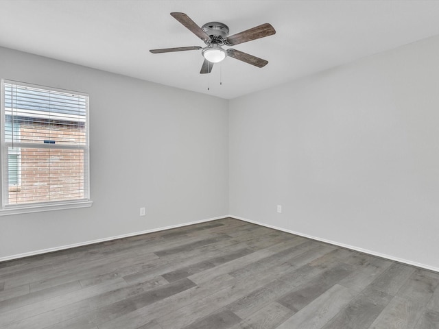 401 Iron Ore Trl, Fort Worth, TX 76131 - unfurnished room featuring wood finished floors, a ceiling fan, and baseboards