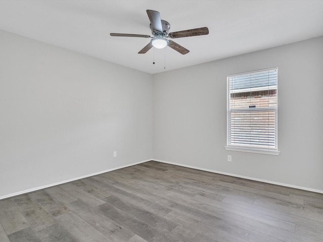401 Iron Ore Trl, Fort Worth, TX 76131 - empty room featuring wood finished floors, a ceiling fan, and baseboards