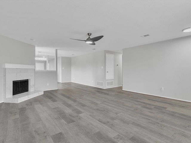 401 Iron Ore Trl, Fort Worth, TX 76131 - unfurnished living room with a ceiling fan, wood finished floors, a fireplace, and baseboards