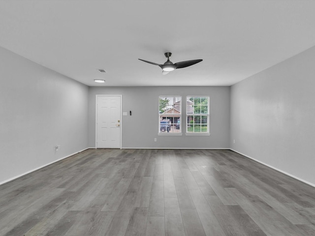 401 Iron Ore Trl, Fort Worth, TX 76131 - unfurnished living room with ceiling fan, wood finished floors, and baseboards
