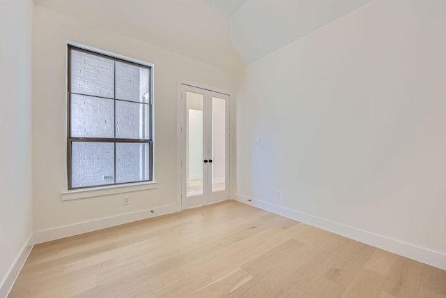 180 Shoreview Dr, Rhome, TX 76078 - empty room featuring light wood-style floors, baseboards, and french doors