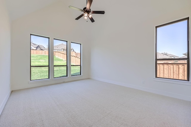 180 Shoreview Dr, Rhome, TX 76078 - spare room with carpet flooring, ceiling fan, baseboards, and high vaulted ceiling