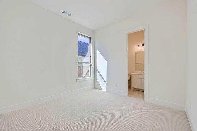 180 Shoreview Dr, Rhome, TX 76078 - unfurnished bedroom featuring light carpet, baseboards, and connected bathroom