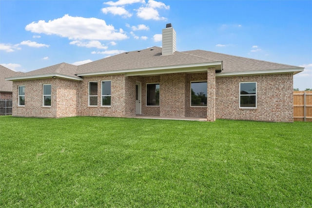 313 Crye Cir, Robinson, TX 76706 - back of property with a chimney, brick siding, a shingled roof, and a patio