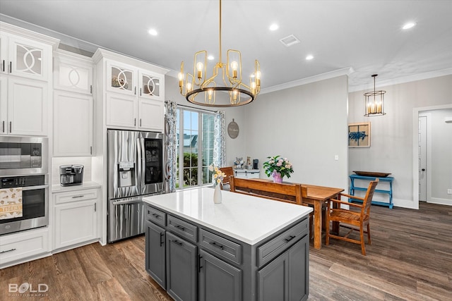 267 Poydras Ave, Bossier City, LA 71111 - kitchen featuring stainless steel appliances, gray cabinetry, a chandelier, white cabinets, and crown molding
