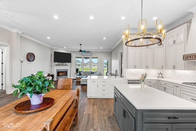 267 Poydras Ave, Bossier City, LA 71111 - kitchen featuring gray cabinetry, light countertops, white cabinets, ceiling fan, and crown molding