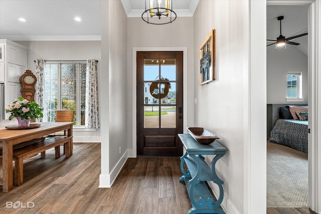267 Poydras Ave, Bossier City, LA 71111 - entryway featuring crown molding, dark wood finished floors, baseboards, a chandelier, and a ceiling fan