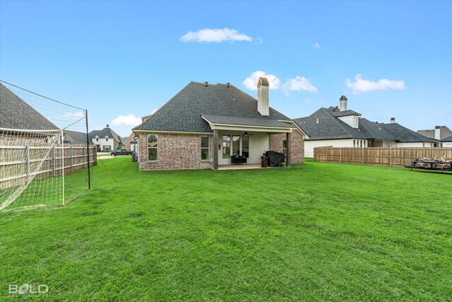 267 Poydras Ave, Bossier City, LA 71111 - rear view of property with a patio area, ceiling fan, brick siding, a chimney, and a shingled roof