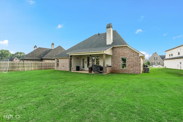 267 Poydras Ave, Bossier City, LA 71111 - rear view of property featuring brick siding, a patio, central AC, ceiling fan, and roof with shingles
