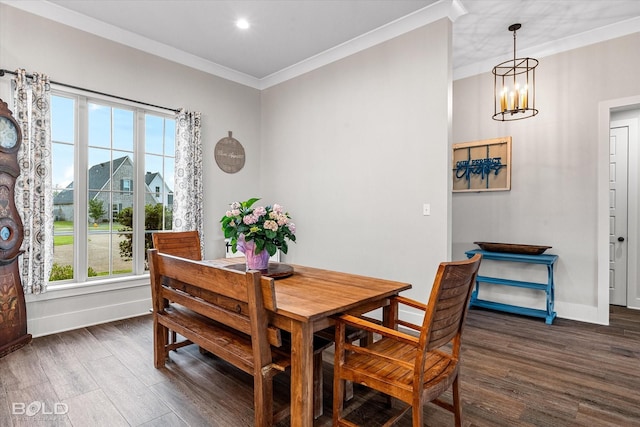267 Poydras Ave, Bossier City, LA 71111 - dining area featuring healthy amount of natural light, a chandelier, dark wood finished floors, crown molding, and baseboards