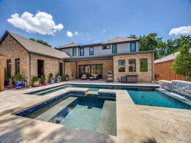 5019 Lark Ln, Dallas, TX 75209 - view of swimming pool featuring outdoor lounge area, a pool with connected hot tub, and a patio