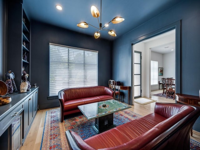 5019 Lark Ln, Dallas, TX 75209 - living area with a chandelier and light wood-style flooring