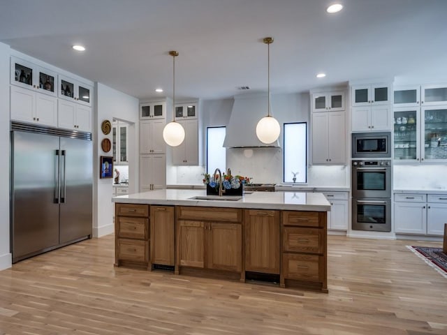 5019 Lark Ln, Dallas, TX 75209 - kitchen featuring built in appliances, backsplash, light wood-style floors, light countertops, and recessed lighting
