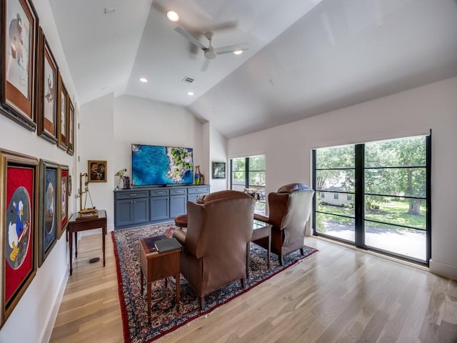 5019 Lark Ln, Dallas, TX 75209 - living room featuring vaulted ceiling, light wood finished floors, ceiling fan, and recessed lighting
