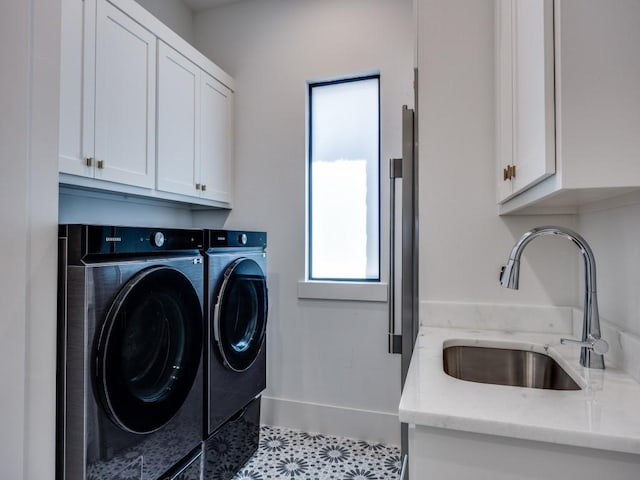5019 Lark Ln, Dallas, TX 75209 - laundry area featuring cabinet space and washing machine and dryer