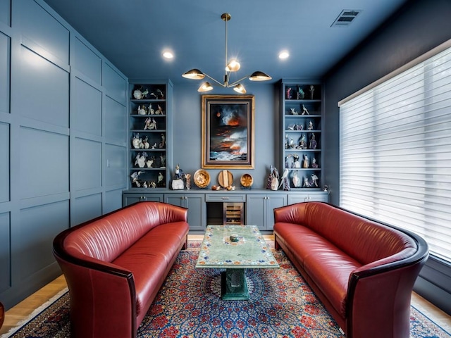 5019 Lark Ln, Dallas, TX 75209 - living area featuring built in shelves and healthy amount of natural light
